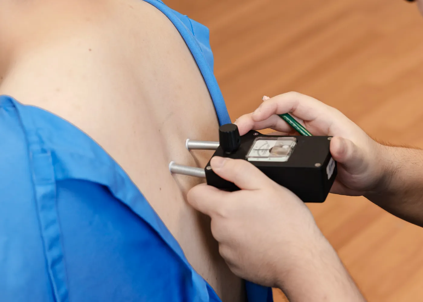 Close up of a nervoscope being run along a patient spine at Persistence Chiropractic Care in Cheras, Kuala Lumpur